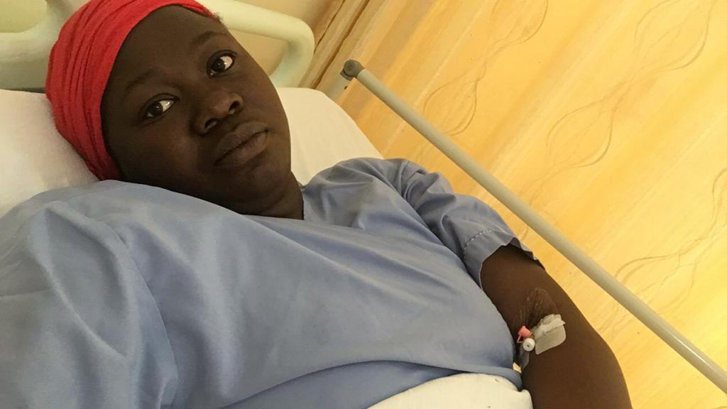 Eunice Omollo, a health reporter, on a hospital bed